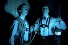 Two brothers hold nooses while wearing lederhosen